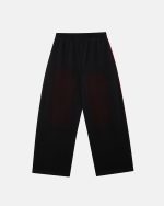 Pantalones Savage lavados, negros y rojos.